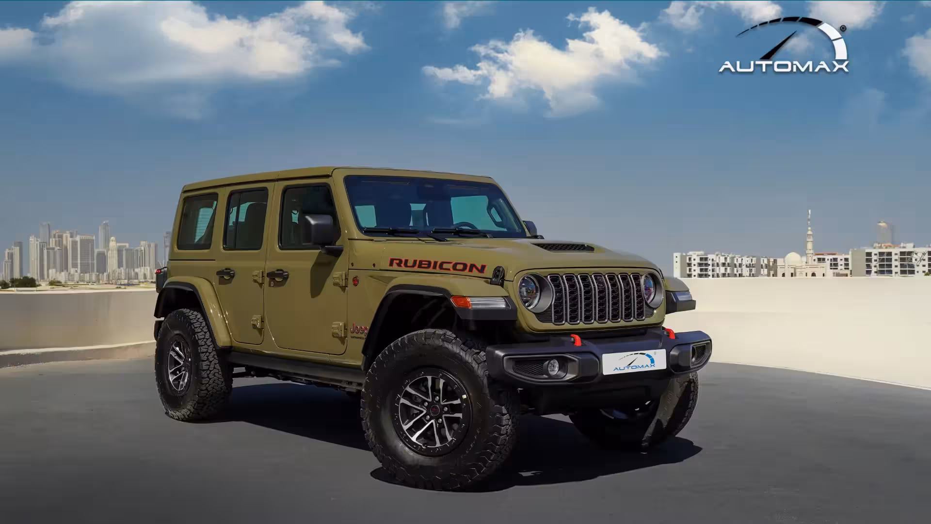 Interior shot showing black leather front seats with red stitching and 'RUBICON' embroidered on the seatbacks.