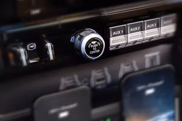 Close-up of a Bilstein Black Hawk e2 shock absorber branded with 'RAM ACTIVE TERRAIN DYNAMICS' and 'BLACK HAWK e2', showcasing the advanced suspension technology.